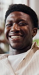 Happy, man and relax with face at house for peace, calm morning and comfortable Saturday. Portrait, male person and laughing with positive attitude, weekend break and funny joke at gathering in home