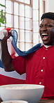 Celebration, streaming and United Kingdom flag with black man on sofa as soccer or sports fan. Cheering, Great Britain and shouting with African supporter in home living room for success or victory