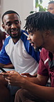 Phone, sports streaming and watching tv with friends on sofa for bonding or support as fans. App, distraction and social gathering with group of people in apartment for competition or tournament