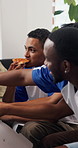 Friends, pizza and watching tv in house with sport competition, conversation and bonding together. People, eating fast food and football broadcast in living room with chat, entertainment and hangout.