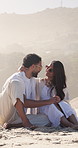 Couple, relax and holding hands on beach with summer holiday, sunglasses or laugh for bonding together. Happy, married people and shades by ocean with love, tropical vacation or discussion for travel