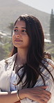 Thinking, peace or Indian woman outdoor with arms crossed, memory or mindfulness on summer holiday. Reflection, satisfaction or person with fresh air, nostalgia or calm perspective on getaway break.