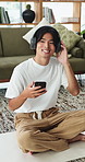Break, headphones or Asian man on yoga mat with phone, song or music subscription in calm activity. Wellness, radio or person in home with tech, chill podcast or audio streaming in holistic practice.