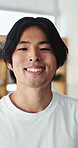 Wellness, face and Asian man in living room with laugh, positive attitude or chill on weekend break. Confidence, portrait or person in house with happiness, satisfaction or good mood in free time.