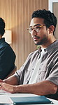 Businessman, typing and office with keyboard in agency for company design or research. Man, employee or designer checking network with glasses for ideas, project agenda or creative tasks in workplace