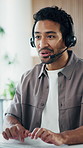 Agent, typing and man with headset in office, happy and discussion with contact for lead generation. Call center, consultant and person with computer for sales, laughing and telemarketing with mic