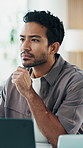 Design, reading and thinking with business man in workplace for planning, research or review. Computer, problem solving and solution with employee in coworking office for web analysis or development