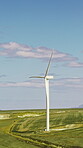 Grass field, wind turbine and renewable energy for sustainability, drone and eco friendly in nature. Countryside, windmill and natural resource with zero emissions in environment, outdoor and space