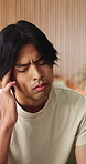 Asian man, headache and fatigue with stress in home for mental health, pressure or strain. Frustrated, male person or anxiety with migraine, ache or pain for vertigo, dizziness or burnout in house