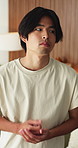 Nervous, thinking and man with stress in home for university crisis, student debt or scholarship risk. Asian person, pensive or thoughtful with worry for college loan, institution pressure or concern