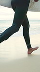 Travel, run and legs at beach with surf board, wave training and vacation hobby at seaside. Holiday activity, jog or male person at ocean with gear, water sports or summer trip in Australia.