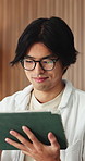 Glasses, man or happy with tablet in home for college portal, study registration or approval. Asian student, tech or eyewear reflection in house for university admission, acceptance email or feedback