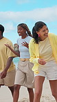 Friends, laugh and walk on beach with summer holiday, funny conversation and bonding together for trip. Happy, people and talk by ocean with travel adventure, vacation outdoor and humor for reunion.