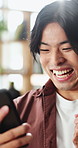 Winner, excited and Asian man with phone in home for good news, online bonus and lottery success. Happy, cellphone and person with fist pump for gambling, sports betting or notification on mobile app