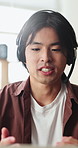 Headset, customer service and man in home with remote work for crm, helpdesk or technical support. Mic, freelancer and Asian male virtual assistant with online contact us or consultation in house. 