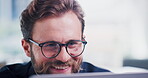 Laughing, businessman and creative with laptop in office, online or research for digital publication. Happy, magazine editor and person with humor for funny article, media and reading with glasses