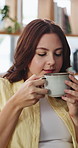 Happy, aroma and woman on sofa with coffee for calm, peaceful and inspiration in morning. Home, weekend and person with caffeine drink for reflection, thoughtful and daydreaming in living room