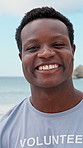 Face, black man and volunteer with smile at beach for earth day, waste management and stop pollution. Portrait, male person and happy employee for recycling, social responsibility and cleaning shore