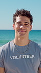 Face, man and volunteer with smile at beach for earth day, waste management and stop pollution. Portrait, male person and happy employee for recycling litter, social responsibility and cleaning shore