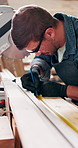 Workshop, wood and carpenter with tape measure, project and woodwork or construction. Saw machine, equipment and material for build with renovation, repair and handyman for furniture small business