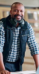 Happy, laptop and face of woodworker in workshop with online order for furniture manufacturing. Smile, carpenter and portrait of mature African male person with computer for industrial website.