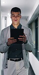 Walking, serious or man with tablet in hallway, review news article or proofreading story for publication. Tech, journalism or editor with grammar check for draft, research and verify feature facts