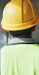 Man, engineer and walk with back for construction with inspection, check progress and expansion. Person, hard hat and supervisor for architecture, building design and safety compliance of renovation