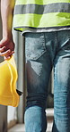 Hand, architecture and man with helmet for protection, construction site or building project. Back, person or employee with hard hat for safety, engineering compliance or inspection for renovation