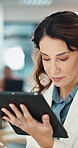 Tablet, reading and businesswoman in office with research for finance report with company budget. Digital technology, communication and female financial manager with email for investment proposal.