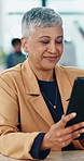 Reading, woman and happy with tablet in office for article editing, draft approval and blog review. Staff, mature editor and smile with tech at media agency for proofreading, fact checking and column