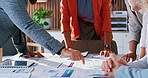 Business people, meeting and pointing with hands on paperwork for team analysis, performance review. Group, employees or collaboration with documents, graph or chart for plan, statistics or analytics