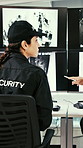 Security, woman and team with camera in control room, working late or communication for surveillance. Watch, monitor and people with technology for protection service, point and discussion at night