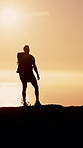 Ocean, hiking and man with view, silhouette and hobby in nature, sunset and fitness. Outdoor, hiker and person with water, summer holiday and trekking for healthy benefits, exercise and reflection