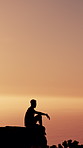 Ocean view, hiking and man with silhouette, relax and journey for hobby, fitness and space. Outdoor, hiker and person with weekend break, vacation and location for holiday, seaside and getaway trip