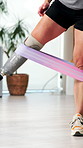 Amputee, person and stretching with prosthetic for physiotherapy, fitness and balance training. Legs, resistance band and patient with disability for limb strength, mobility and gait rehabilitation