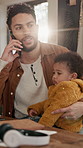 Phone call, baby and father in home, smile and freelancer with multitasking, contact and infant care. Copywriting, dad or happy man in lounge, child and cellphone for communication and remote work
