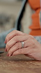 Hand, divorce and woman with anxiety in home, marriage doubt or infidelity with affair. Person, nervous and fidget in house for separation, crisis or stress on table for mistake with wedding ring