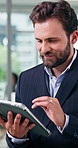 Business, man and reading with tablet in office for research, finance report and bookkeeping. Male person, scroll and tech with budget review, financial audit and risk management at investment agency