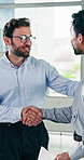 Happy, businessmen or handshake with paperwork for business deal, partnership or performance review. Male people, employees or colleagues shaking hands with documents for company agreement in office
