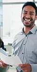 Face, confident and businessman with paperwork in office, professional investor and trading proposal. Portrait, smile and employee with pride for risk assessment report, laugh and investment plan