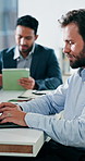 Review, typing or man in office with laptop, forecast report or budget research for funding pitch. Meeting, digital or finance consultant with tech, portfolio check or proposal draft for investment.