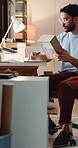Box, logistics and writing with man in office for delivery, distribution or shipment tracking. Ecommerce, notebook and supply chain with courier person in warehouse for shipping management or service