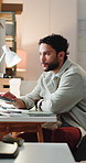 Logistics, schedule and typing with man in office for delivery, distribution or shipment tracking. Computer, ecommerce and supply chain with courier person in warehouse for shipping management