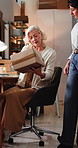 Women, box and team with discussion for dropshipping, check label or inventory management for logistics. People, talk and inspection with package, supply chain or stock with admin at small business