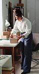 Woman, boxes and label with writing for dropshipping, entrepreneurship and stock for logistics. Person, admin and inventory management with package, supply chain and distribution at small business