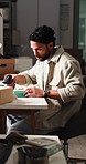 Logistics, scanner and man with box in office, parcel tracking and processing order for delivery. Writing, customs info and entrepreneur with package in dropshipping startup, distribution and tech