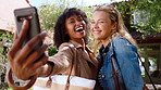 Happy women, friends and hug with selfie in resort for holiday memory or photography together. Excited, female people or smile with picture or capture moment for social media post, travel or vacation