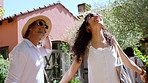 Happy people, friends and walking with group on vacation for travel in natural holiday resort. Community, tourist or excited travelers with smile in nature for outdoor getaway or check in together