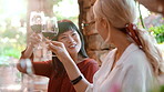 Conversation, toast or friends with wine at restaurant, social gathering or tasting event for reunion. Drink alcohol, speaking or happy people with celebration for support, bonding or cheers together