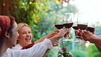 Happy, friends and cheers with red wine in backyard for support, celebration and lunch reunion. Smile, people and toast alcohol for gathering, hangout together and gratitude of Easter holiday in home